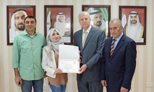 AAU President honored student Baraa Turkmany for her excellency in the Achievement Exam