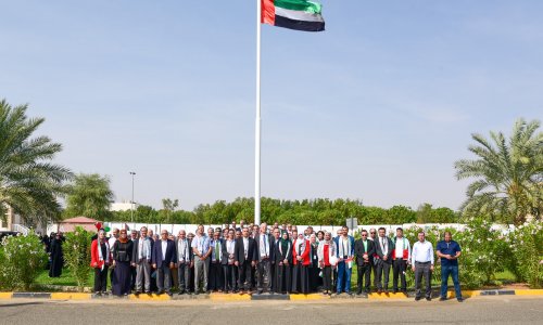 Al Ain University proudly raises the UAE flag